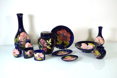 Lot 212 - A group of Moorcroft pieces, each with a blue...