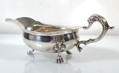 Lot 262 - A 19th century metalwares sauce boat, instinct...