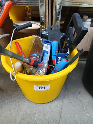 Lot 69 - Yellow bucket with hand saws, claw hammer,...
