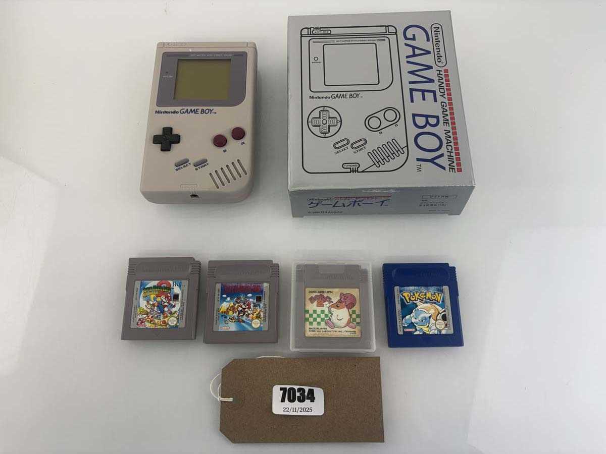 Lot Boxed GameBoy together with 4 games to include...