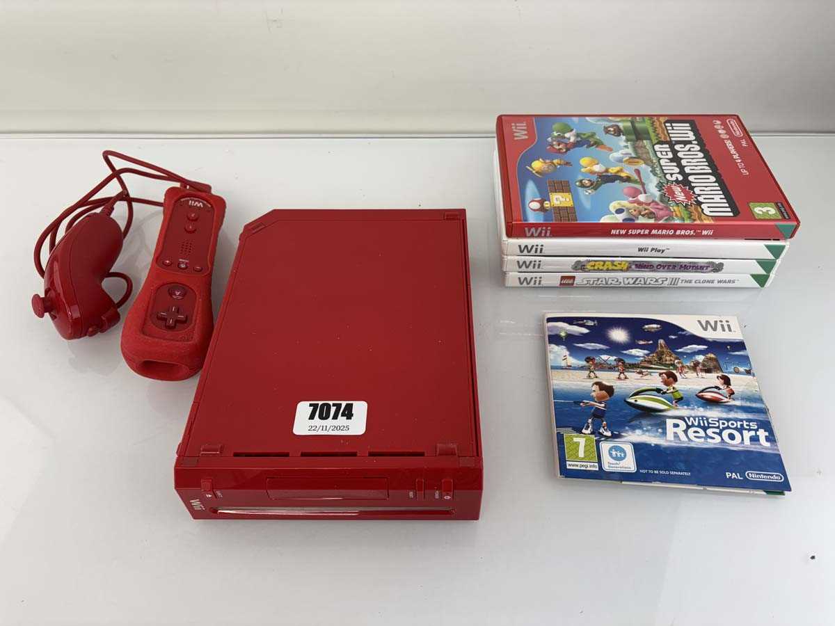 Lot Nintendo Wii in red with 5x games to include...