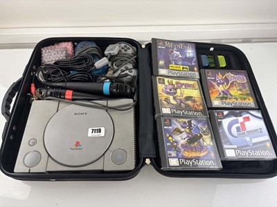 Lot PlayStation in carry case with 5x games,...
