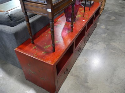 Lot 1311 - Modern red painted open front entertainment...