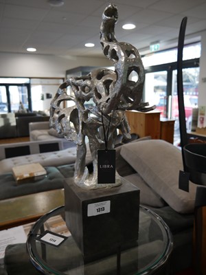 Lot 1313 - Silver coloured elephant ornament on plinth