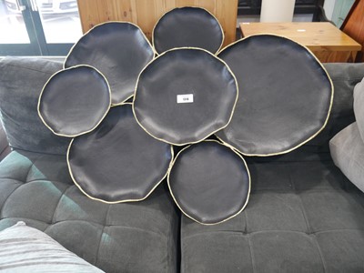 Lot 1318 - Large black and gilt finish lily pad type wall...