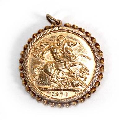 Lot 870 - A sovereign dated 1976 in a loose yellow metal...