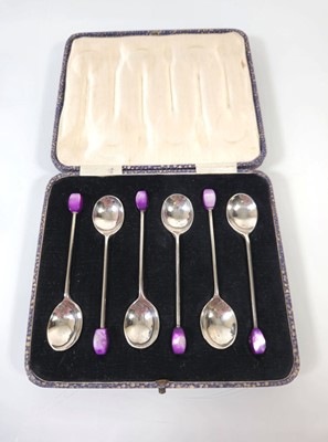 Lot 265 - A cased set of six silver bean spoons with...