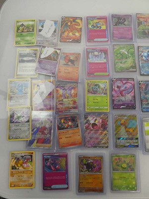 Lot 7736 - Qty of loose & Top loaded Pokémon cards from...