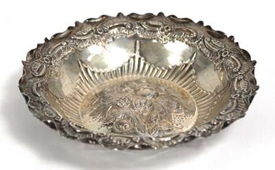 Lot 313 - A Victorian stamped silver dish of circular...