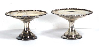 Lot 315 - A pair of small silver tazzas with beaded...