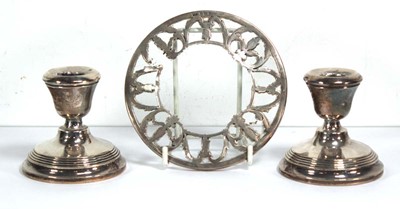Lot 322 - A pair of silver dwarf candlesticks of typical...