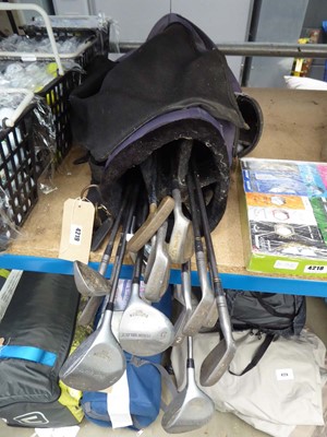 Lot 4219 - Vintage golf bag with an assortment of clubs...
