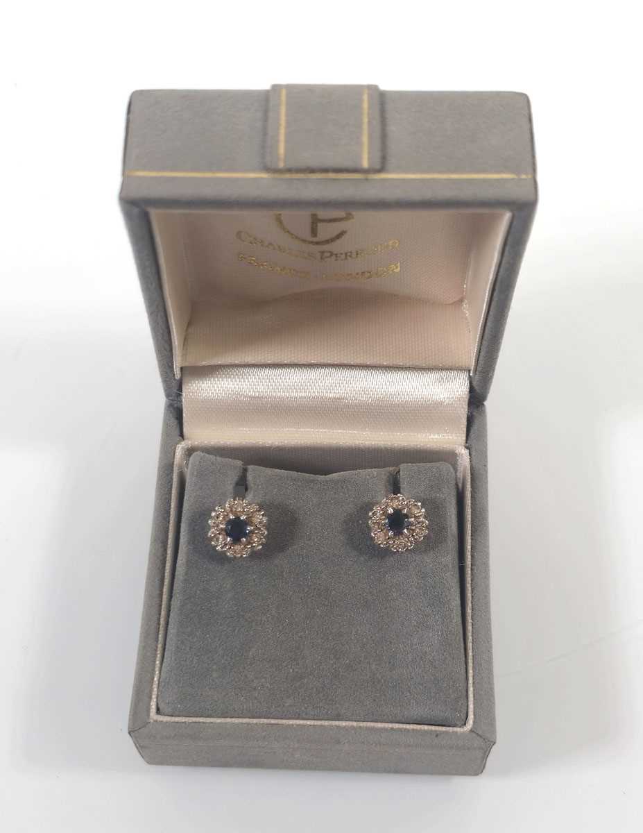 Lot 433 - A pair of white metal, sapphire and diamond...