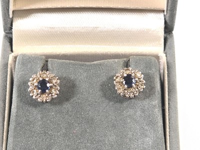 Lot 433 - A pair of white metal, sapphire and diamond...