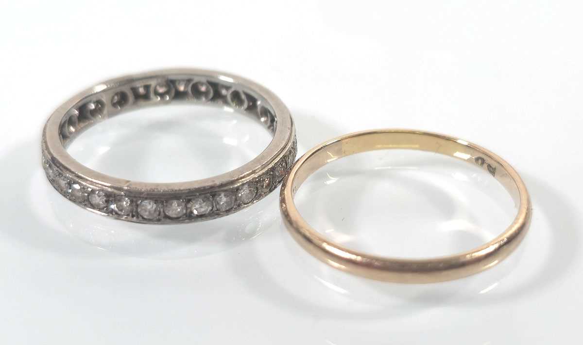 Lot 435 - A white metal full eternity ring together with...