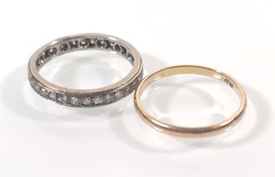 Lot 435 - A white metal full eternity ring together with...