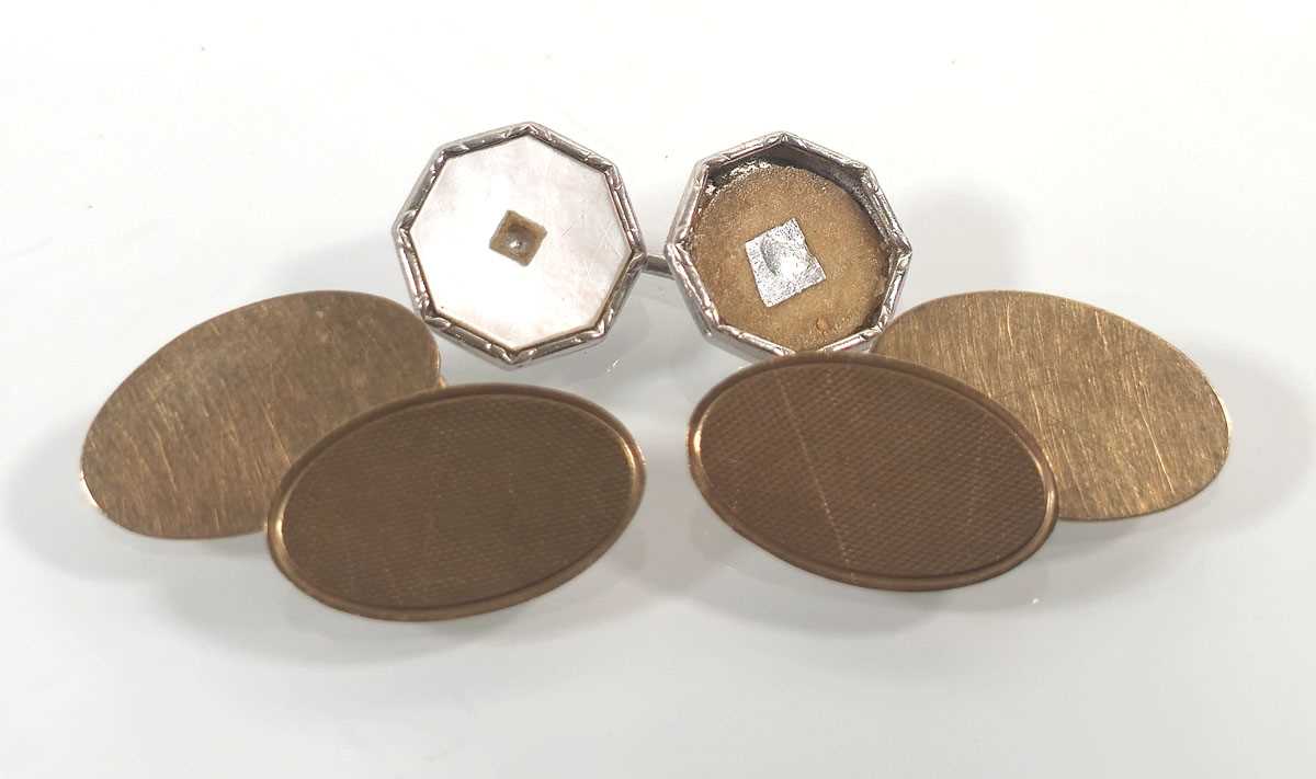 Lot 437 - A pair of 9ct gold engine turned cufflinks...