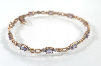 Lot 438 - A 9ct gold and amethyst bracelet. Approx....