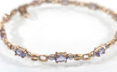 Lot 438 - A 9ct gold and amethyst bracelet. Approx....