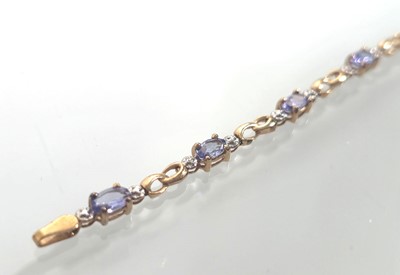 Lot 438 - A 9ct gold and amethyst bracelet. Approx....