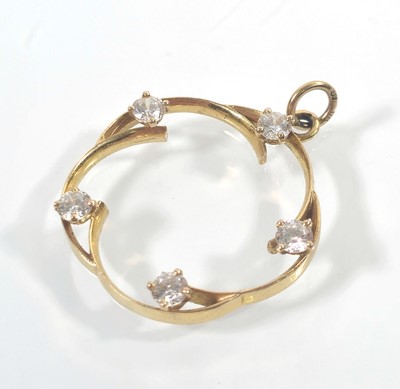 Lot 440 - A 9ct gold openwork pendant set with white...