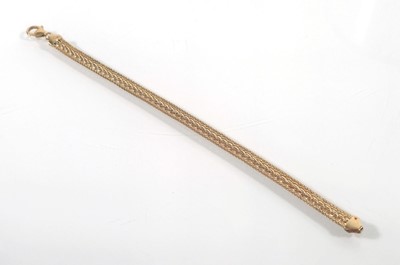 Lot 444 - A 9ct gold flat link bracelet. Approx. weight...