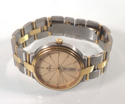 Lot 448 - A gentleman's stainless steel/yellow metal...