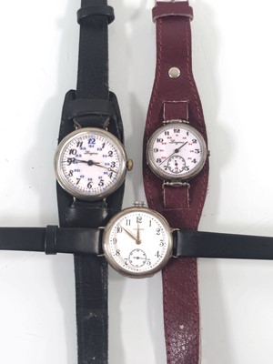 Lot 453 - Three early 20th century trench style watches,...