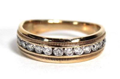 Lot 826 - A 10ct yellow gold half eternity ring set...