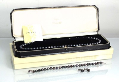 Lot 842 - A single strand Tahitian pearl necklace with...