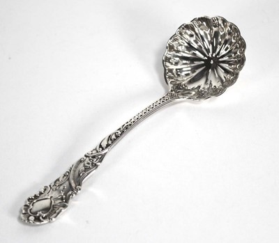 Lot 357 - A silver sifting spoon of rococo design, maker...