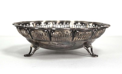 Lot 372 - A small silver dish of flowerhead form on...