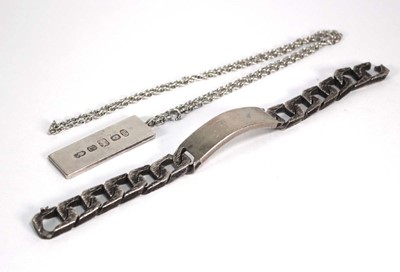 Lot 377 - A silver bark design identity bracelet, London...