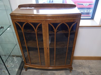 Lot 1306 - Dark oak bow front glazed display cabinet