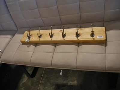 Lot 1369 - Set of 6 brass finish coat hooks on...