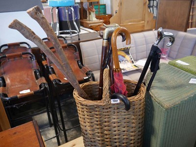 Lot 1381 - Wicker stick stand with contents of various...