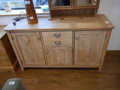 Lot 1383 - Limed wood sideboard with 2 central upper...