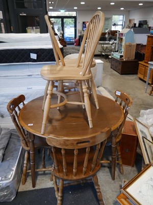 Lot 1384 - Dark oak finish drop leaf circular dining...