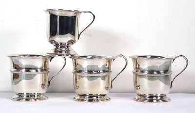 Lot 391 - A set of three silver cups of typical form,...