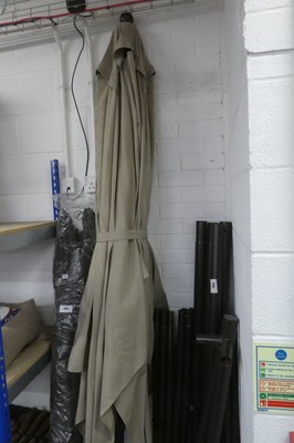 Lot 2053 - Large beige cloth wind-up garden parasol