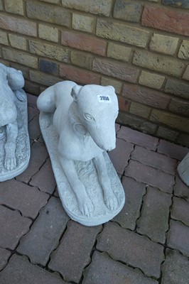 Lot 2056 - Large pair of concrete dogs laying down