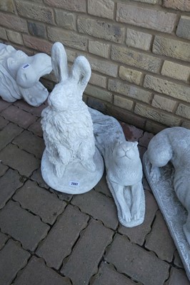 Lot 2087 - Concrete rabbit, together with laying down hare