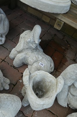 Lot 2142 - Concrete elephant laying down with a concrete...