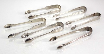 Lot 404 - Six pairs of Georgian and later silver sugar...