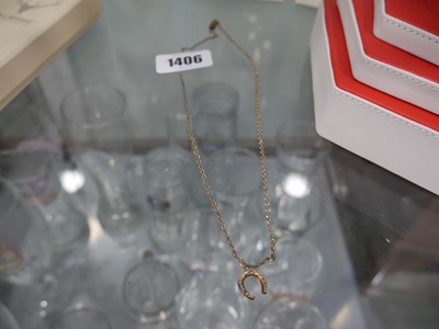 Lot 1406 - Necklace in the form of a horse shoe, the...