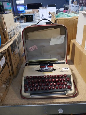 Lot 1554 - Red cased Olympia typewriter