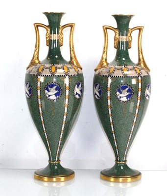 Lot 204 - A pair of Royal Worcester two handled vases of...
