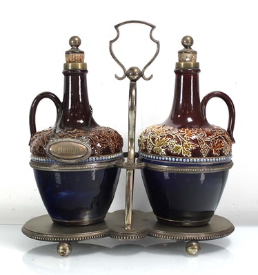 Lot 209 - A plated cradle containing a pair of Doulton...