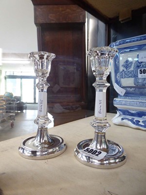 Lot 5002 - Pair of glass candlesticks with loaded silver...