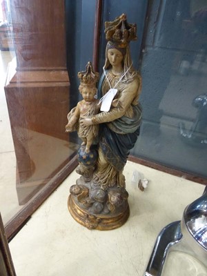 Lot 5009 - A polychrome figural group modelled as Madonna...